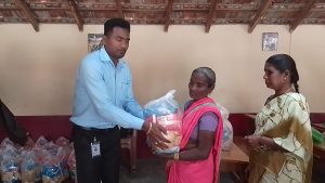 Distributing Sarees and Dry Rations to 50 vulnerable women and men.
